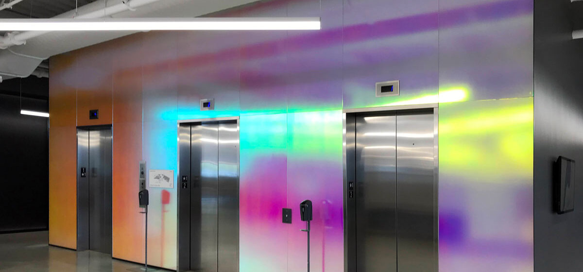 Pluralsight dichroic glass lobby with soft-etched finish