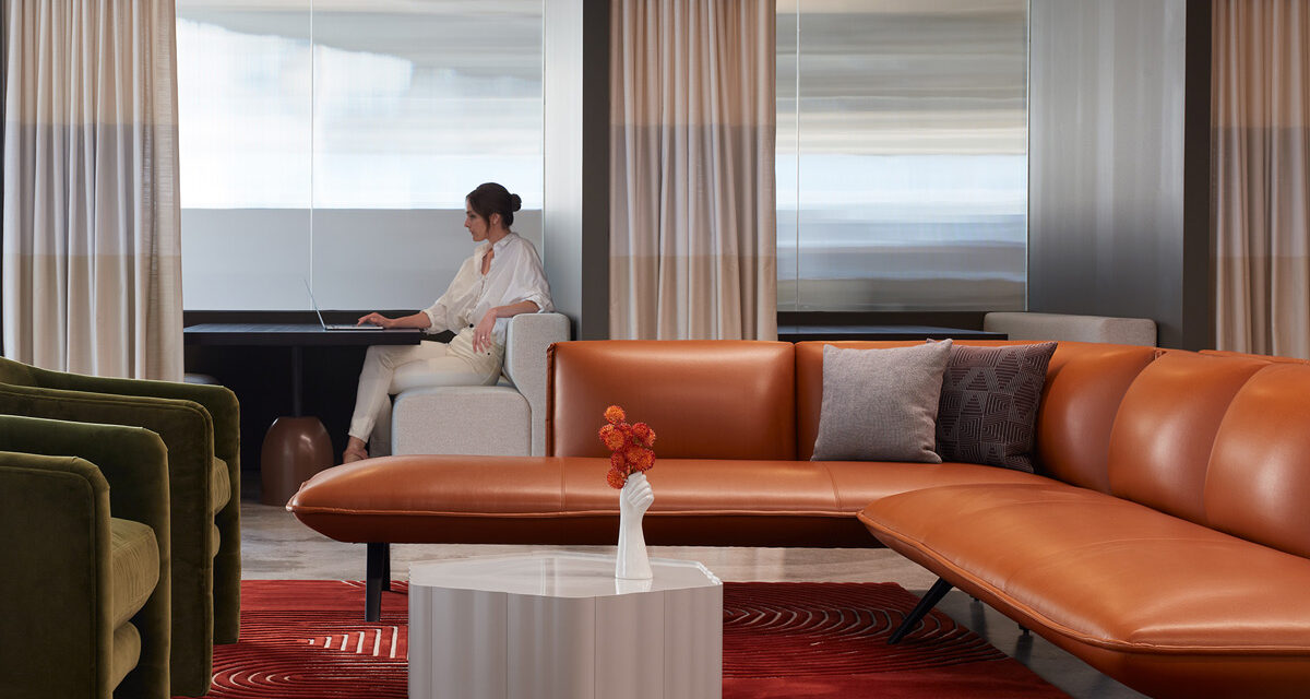 Woman sitting in front of Houdini privacy glass wall