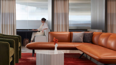 Woman sitting in front of Houdini privacy glass wall