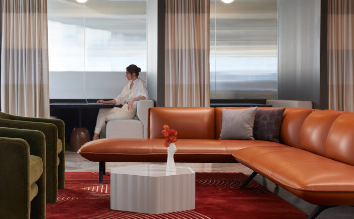 Woman sitting in front of Houdini privacy glass wall