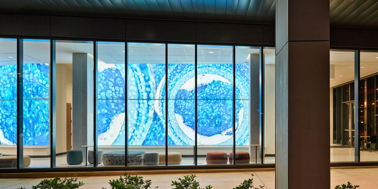 Bendheim TurnKey Fusion glass cladding system in a lobby, seen from outside.