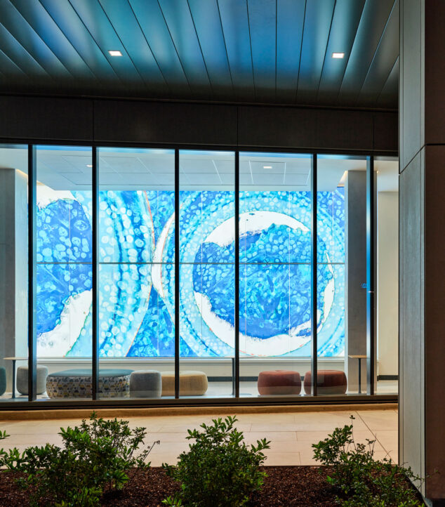 Bendheim TurnKey Fusion glass cladding system in a lobby, seen from outside.