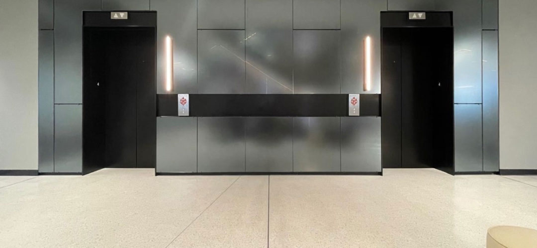 TurnKey glass wall cladding at an elevator lobby.