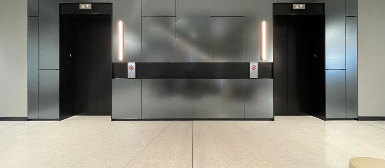 TurnKey glass wall cladding at an elevator lobby.
