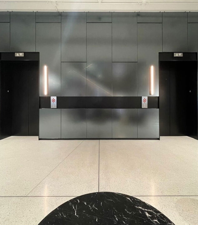 TurnKey glass wall cladding at an elevator lobby.