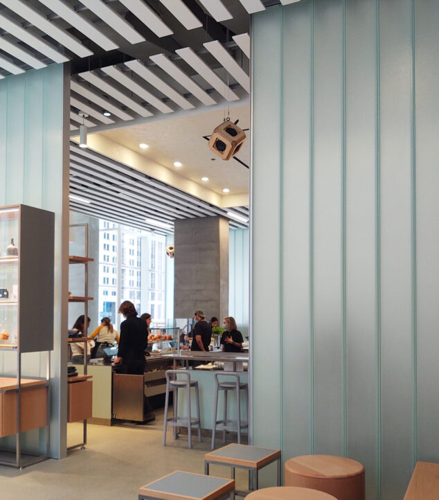 Channel glass partiton walls and etched glass cladding the counters.