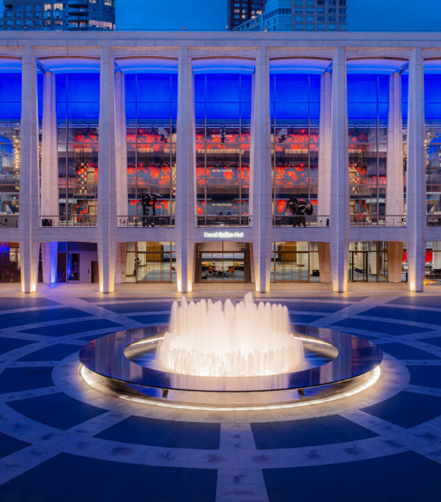 David Geffen Hall at night with Bendheim's illuminated glass wall.