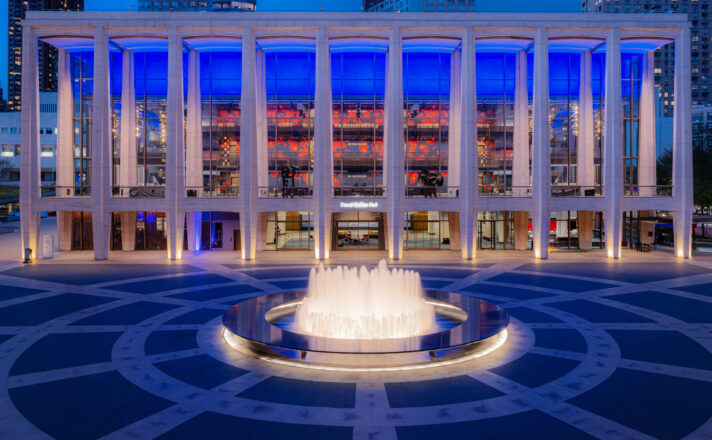 David Geffen Hall at night with Bendheim's illuminated glass wall.