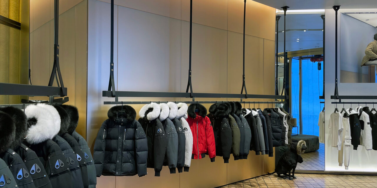 Etched glass behind merchandise stands.