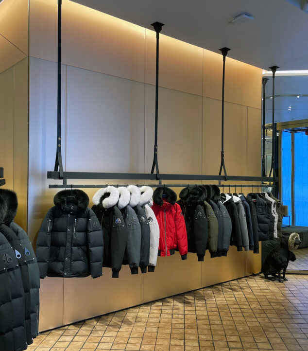 Etched glass behind merchandise stands.