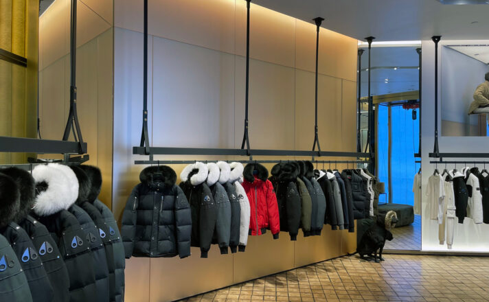 Etched glass behind merchandise stands.