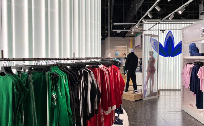 Channel glass partition wall in Adidas store.