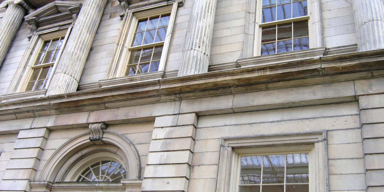 Restoration Glass® in the windows of the Branch Bank of the United States facade at the Metropolitan Museum of Art.