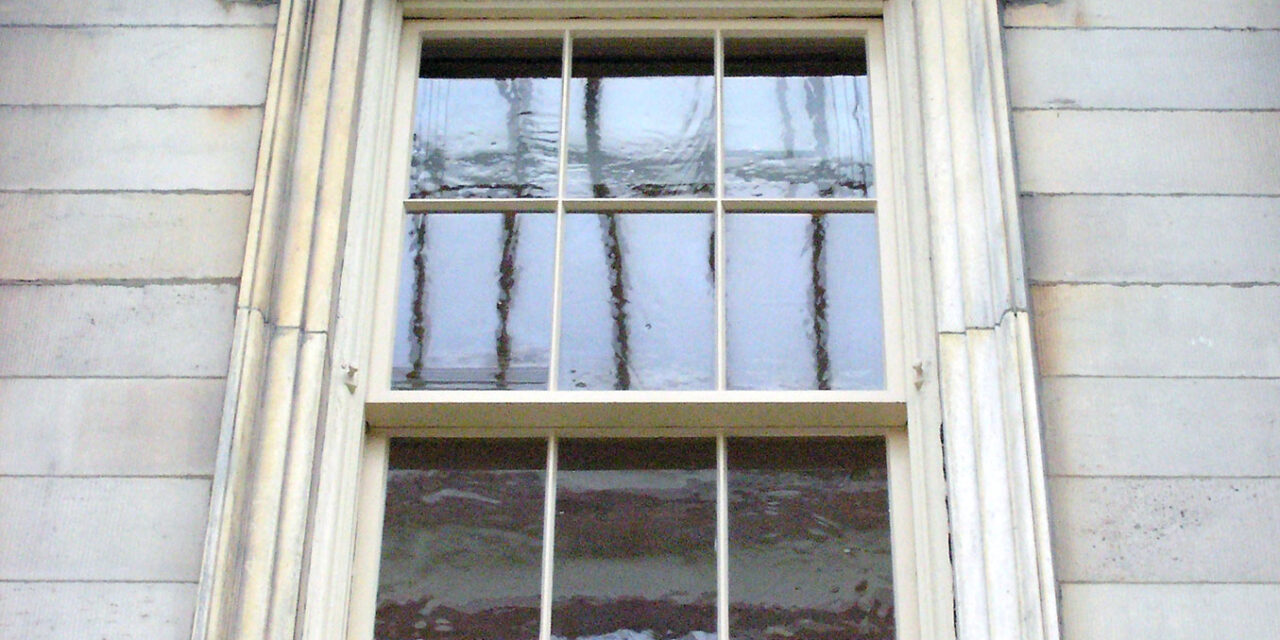 Restoration Glass® in the windows of the Branch Bank of the United States facade at the Metropolitan Museum of Art.