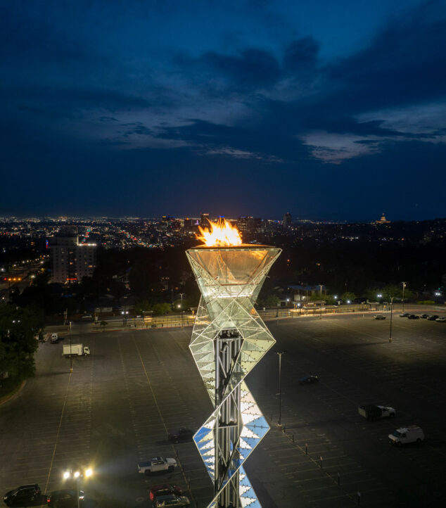 Olympic Cauldron torch lit at night.