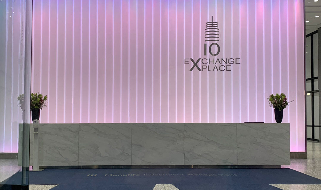 Back-lit channel glass wall in a lobby.