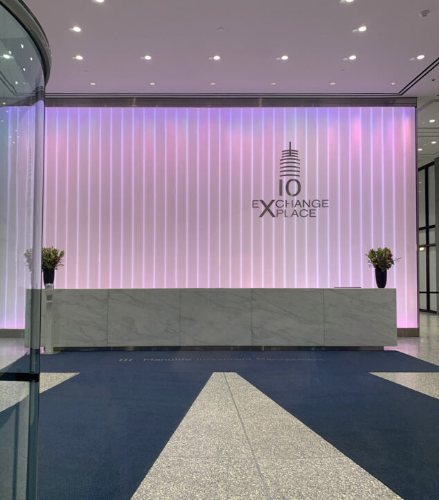 Back-lit channel glass wall in a lobby.