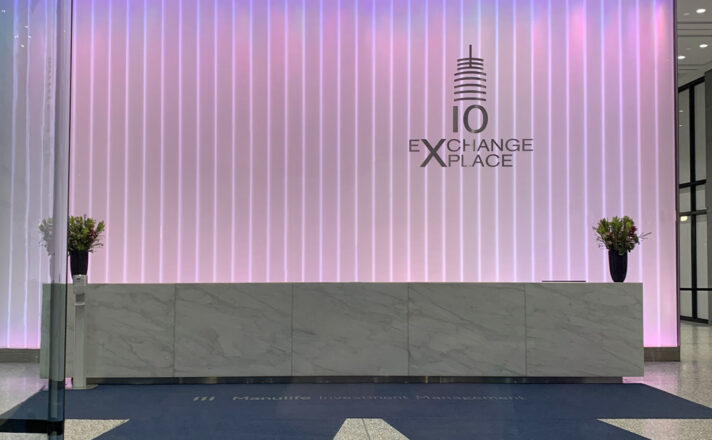 Back-lit channel glass wall in a lobby.