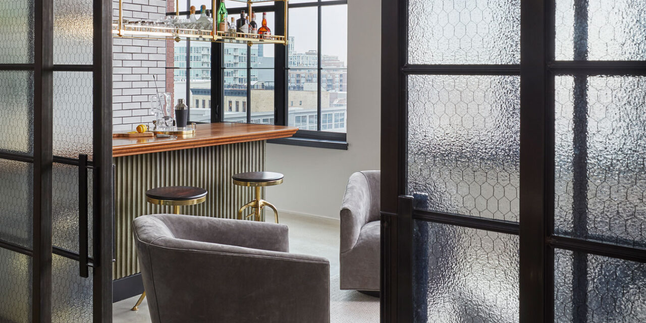 Lounge with doors and walls made of Bendhiem's chicken wire glass.