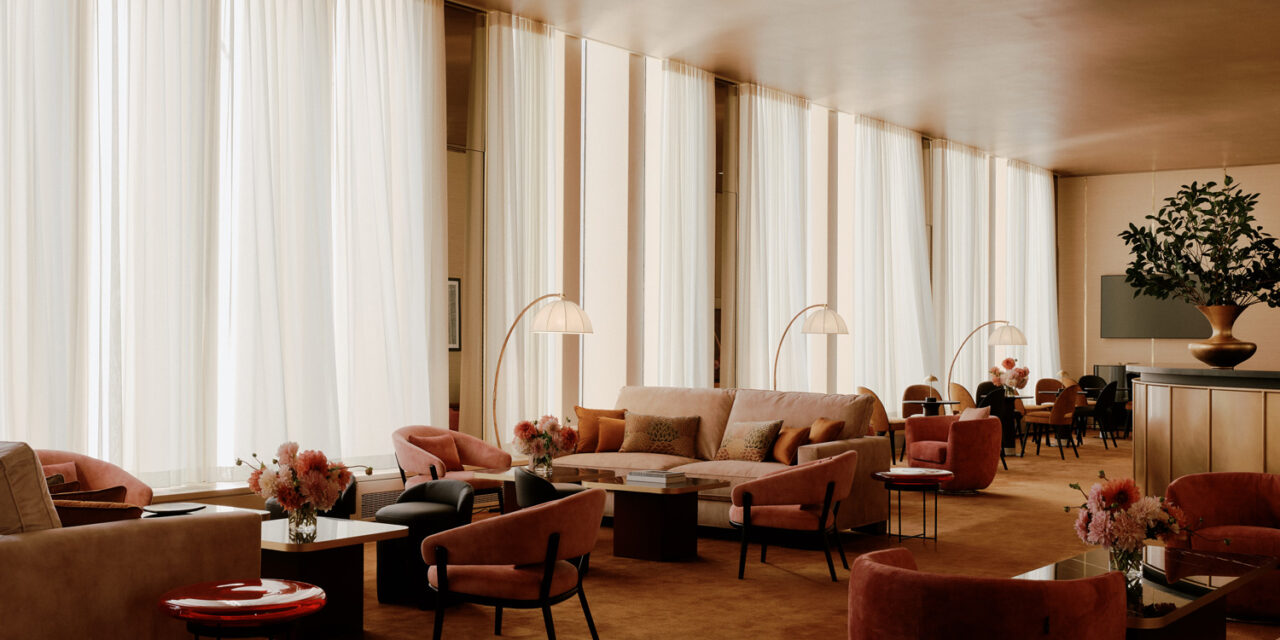 Bendheim bronze mirror clads the walls between the windows.