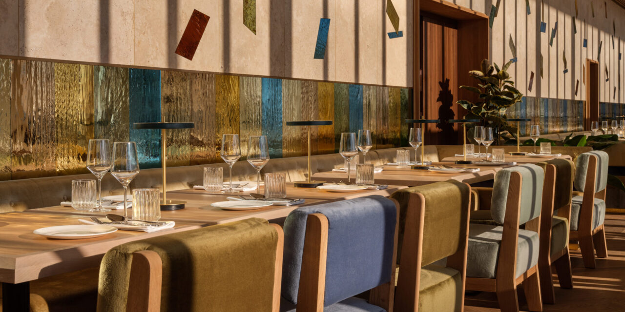 Restaurant with colorful mirrored mouth-blown glass panels in the walls.