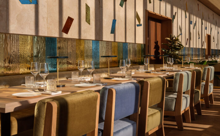 Restaurant with colorful mirrored mouth-blown glass panels in the walls.