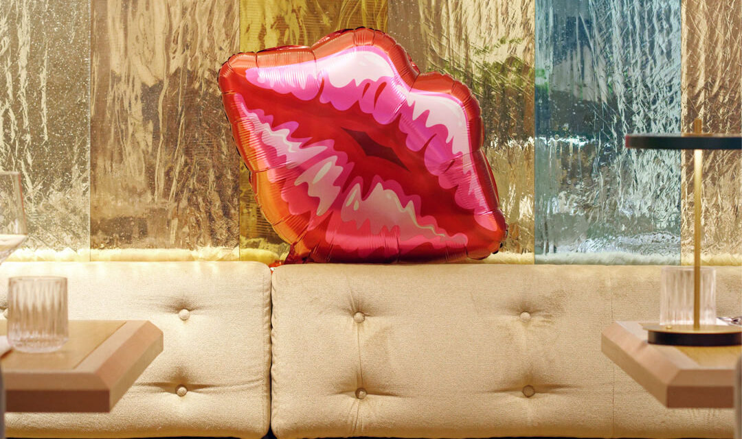 Restaurant with colorful mirrored mouth-blown glass panels in the walls.