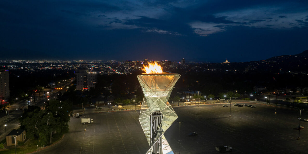 Olympic Cauldron torch lit at night.