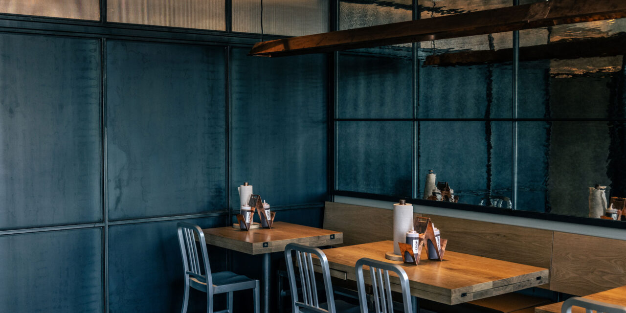 Textured mirrored glass wall in a restaurant.