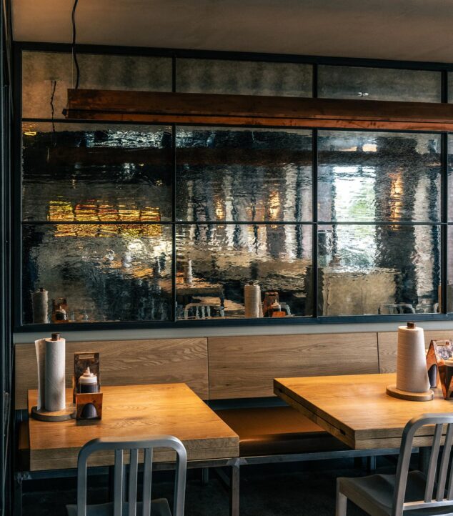 Textured mirrored glass wall in a restaurant.