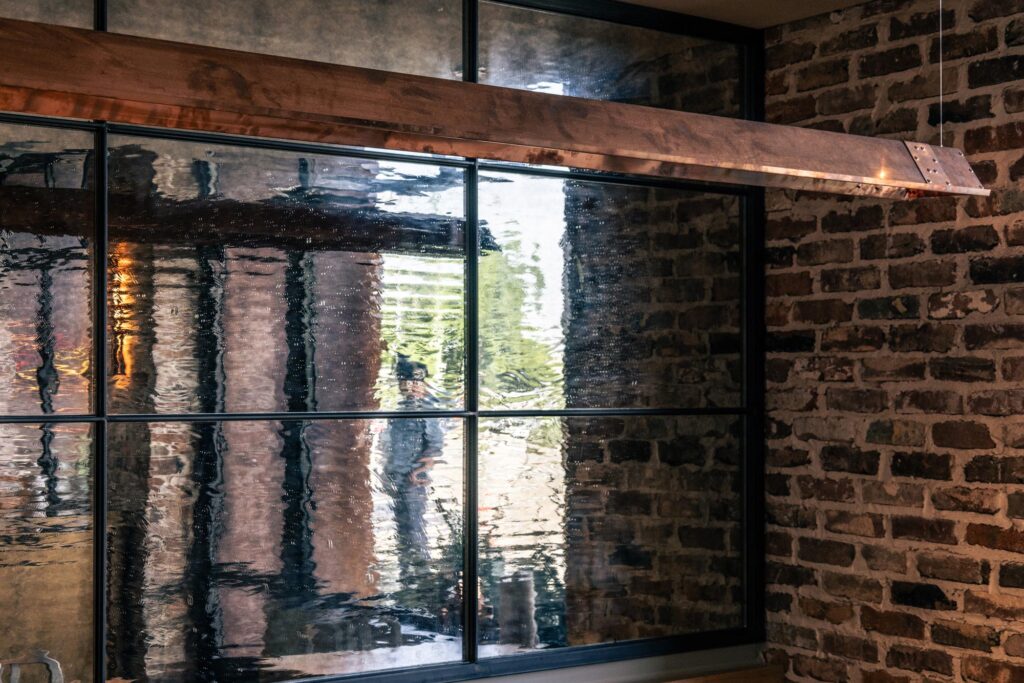 Textured mirrored glass wall in a restaurant.