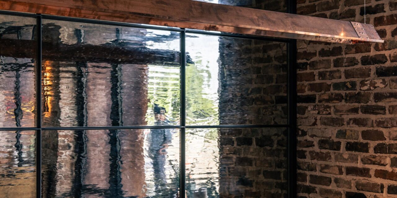 Textured mirrored glass wall in a restaurant.