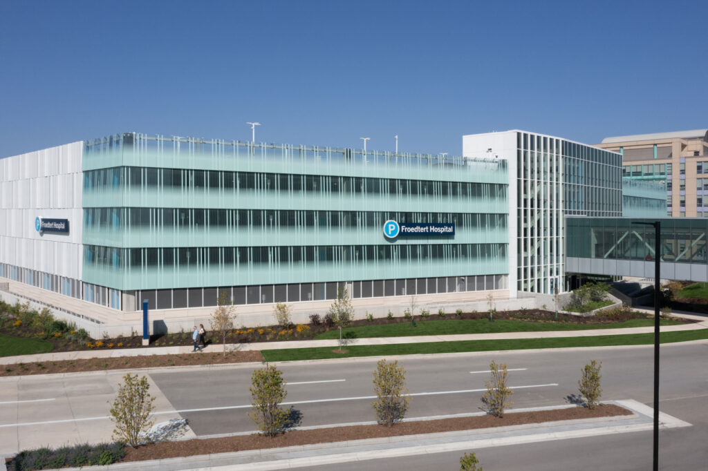 Bendheim glass rainscreen system on the exterior of a parking structure.