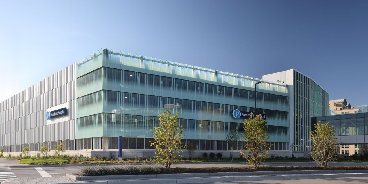 Bendheim glass rainscreen system on the exterior of a parking structure.