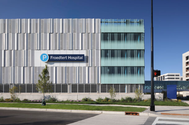 Bendheim glass rainscreen system on the exterior of a parking structure.