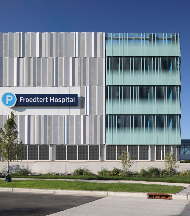 Bendheim glass rainscreen system on the exterior of a parking structure.