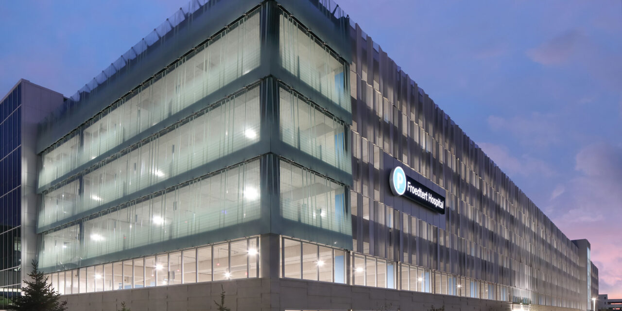 Bendheim glass rainscreen system on the exterior of a parking structure.