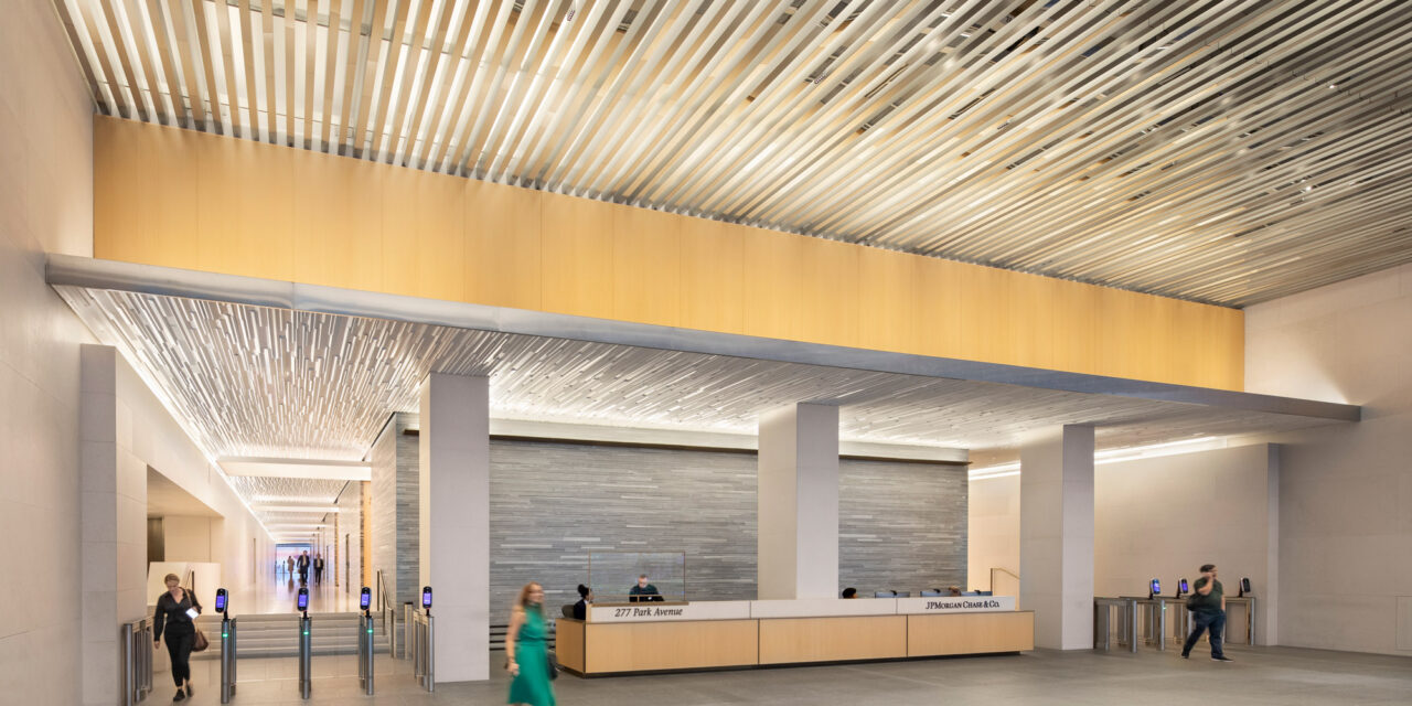 Bendheim laminated glass cladding the walls of a corporate lobby.