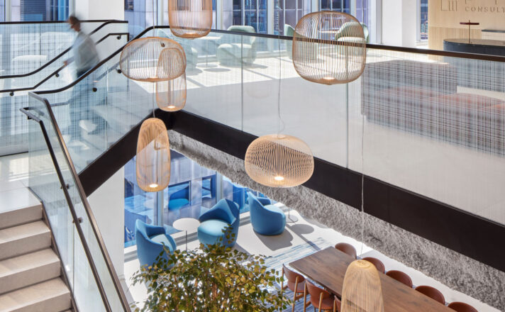 Glass stair railing by Bendheim with a woven digital printed pattern.