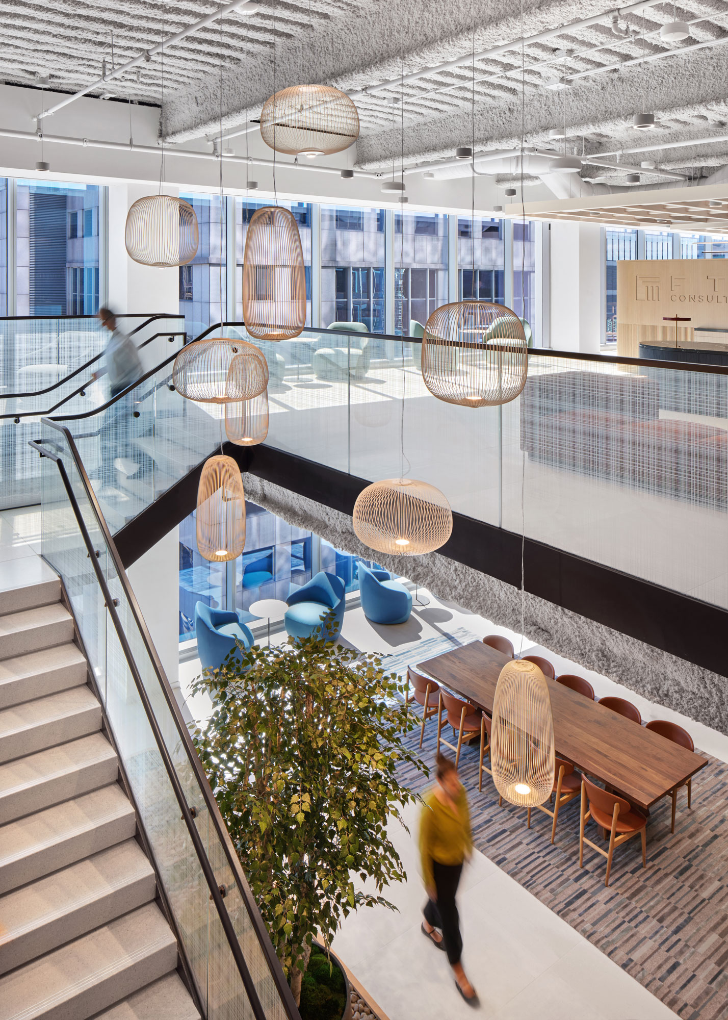 Glass stair railing by Bendheim with a woven digital printed pattern.