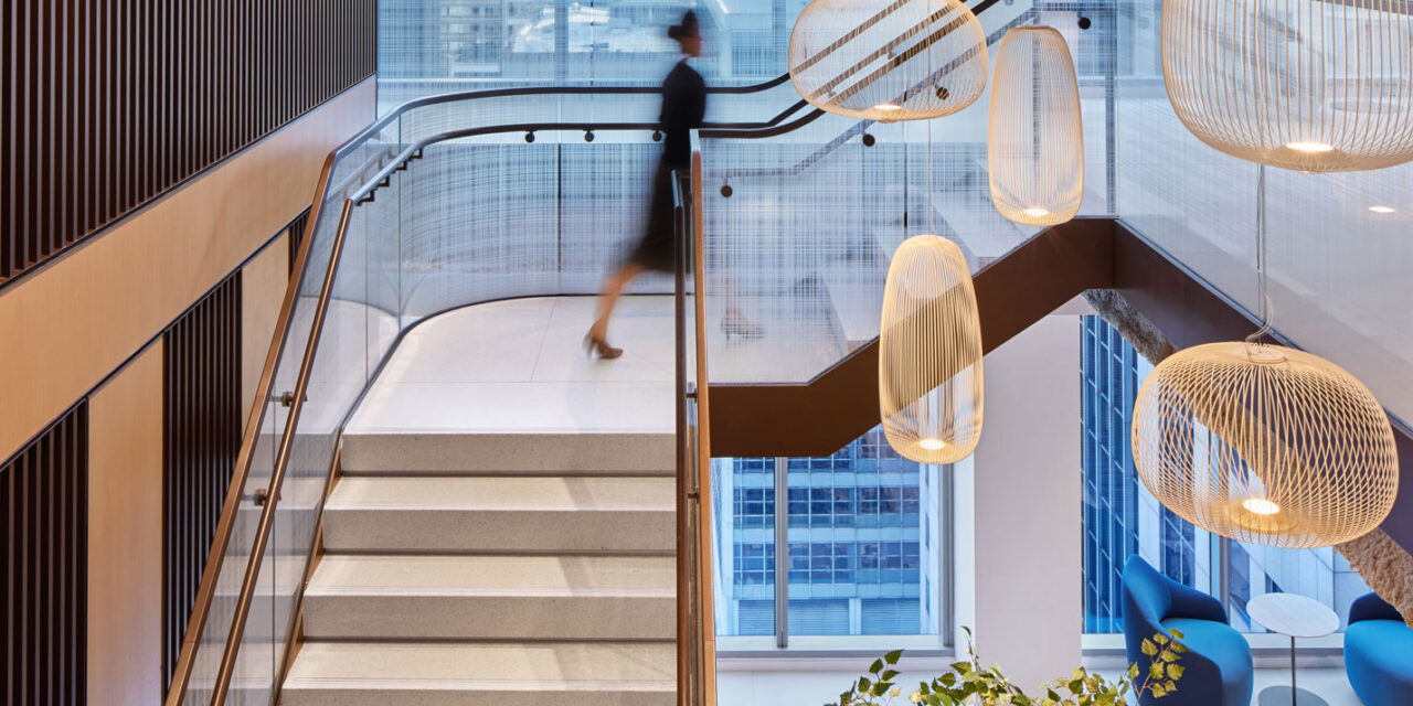 Glass stair railing by Bendheim with a woven digital printed pattern.