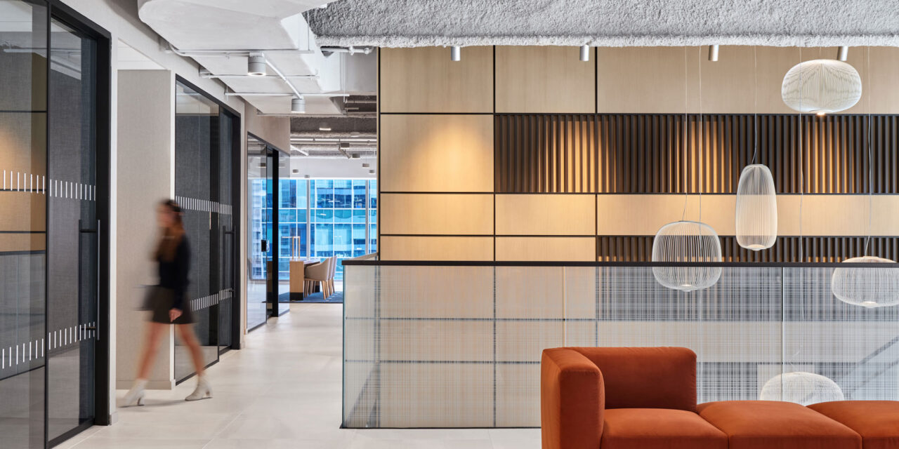 Glass stair railing by Bendheim with a woven digital printed pattern.