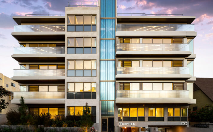 Apartment building with railings made of Bendheim's textured glass, and a facade of Bendheim channel glass.