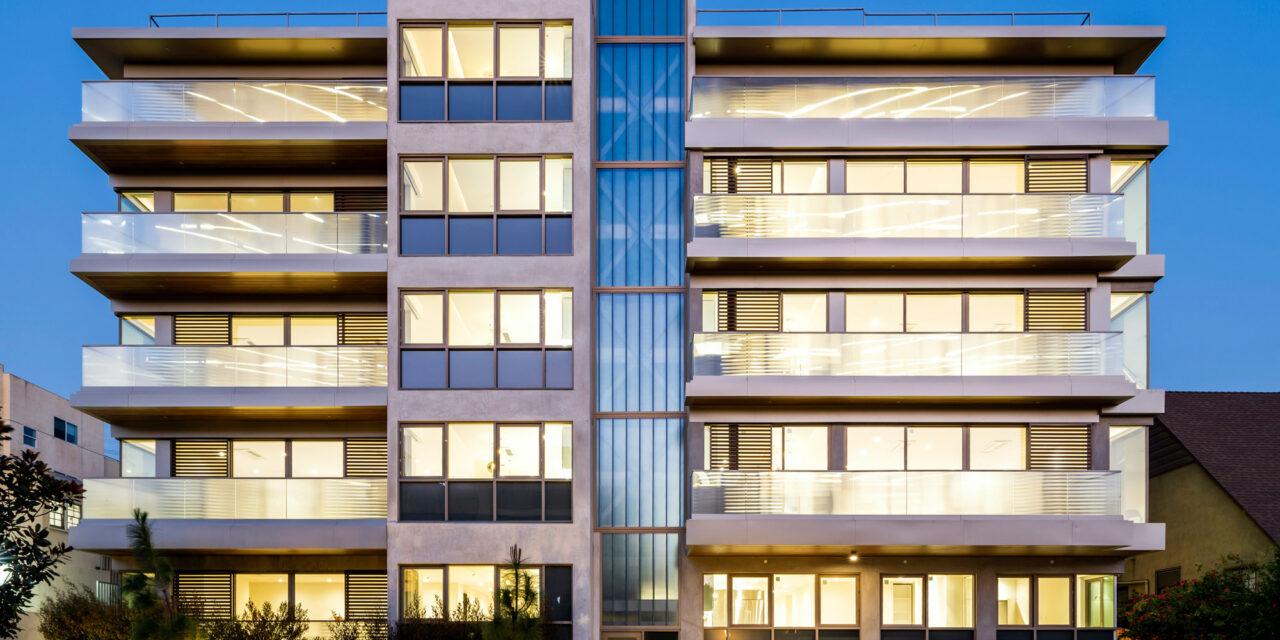Apartment building with railings made of Bendheim's textured glass, and a facade of Bendheim channel glass.