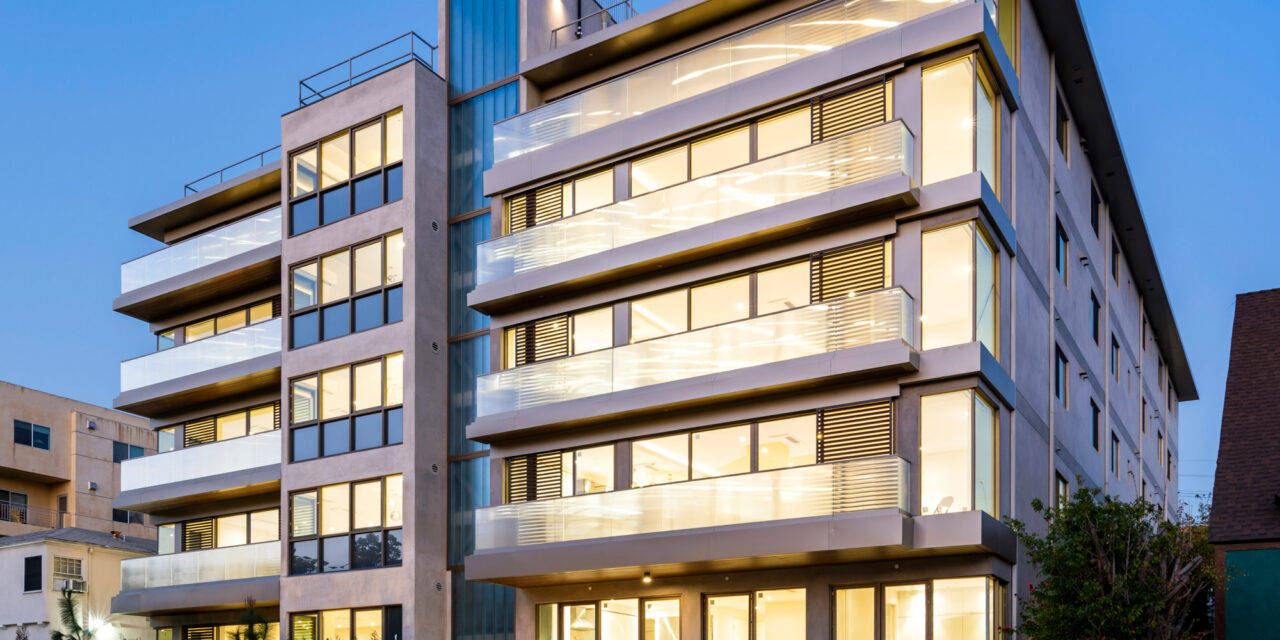 Apartment building with railings made of Bendheim's textured glass, and a facade of Bendheim channel glass.