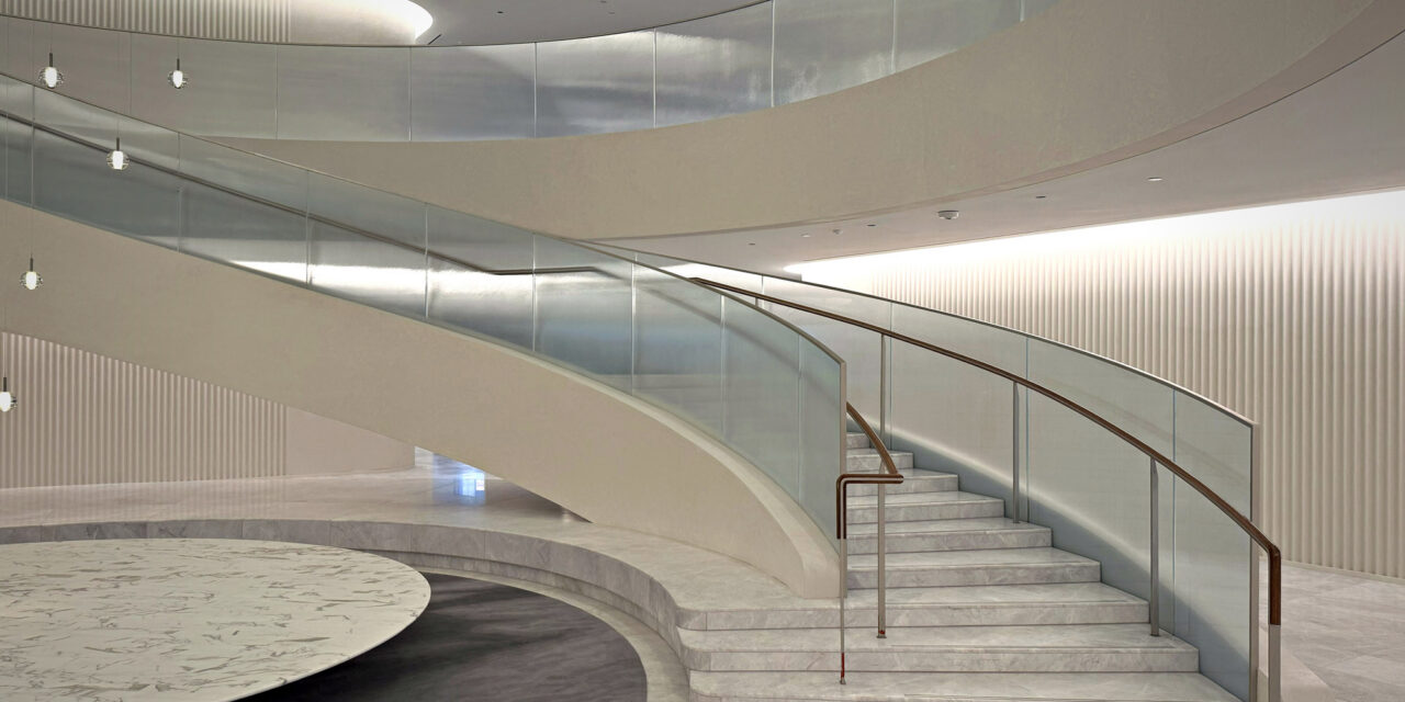 Textured glass railing of a stairwell in an office.