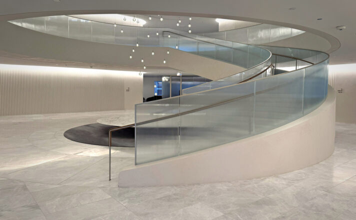 Textured glass railing of a stairwell in an office.
