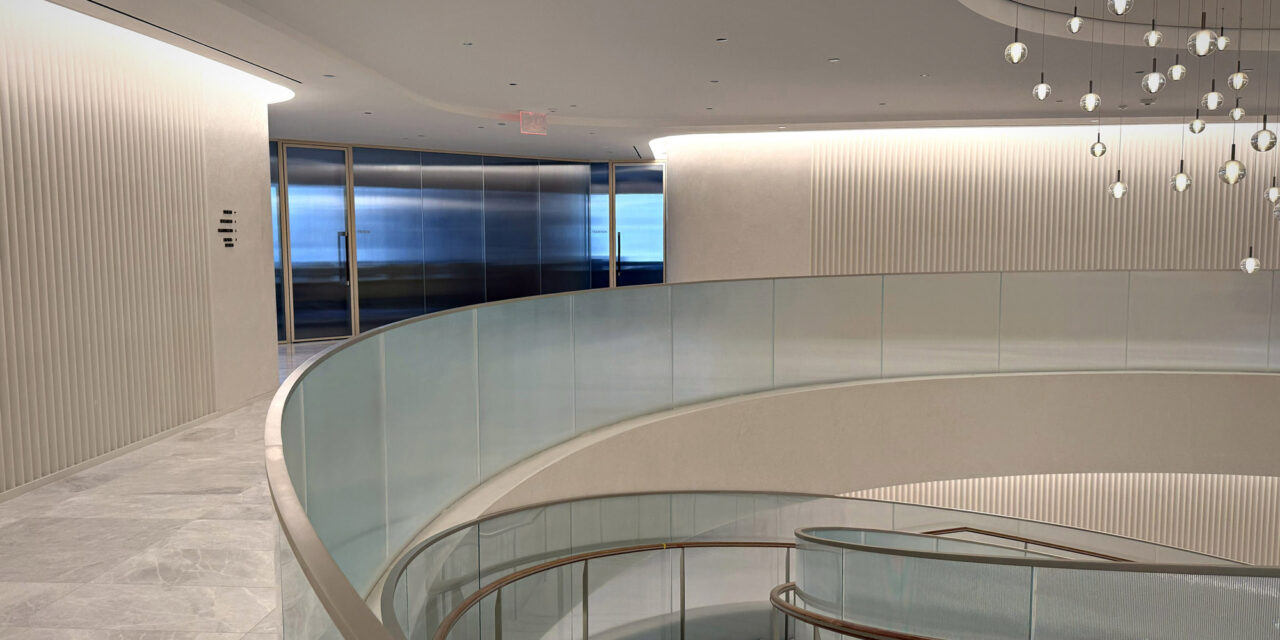 Textured glass railing of a stairwell in an office.